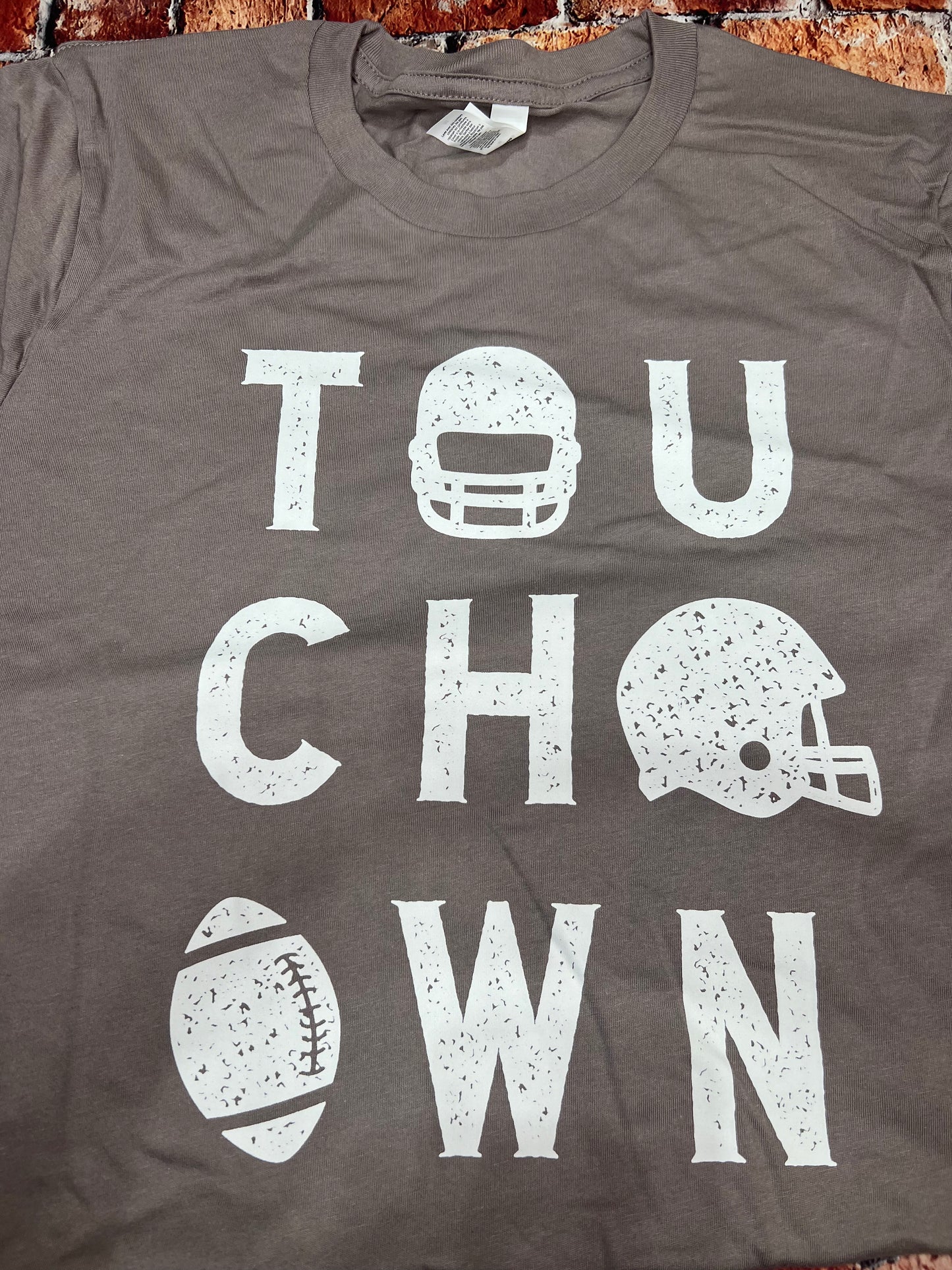 MED - TOUCHDOWN t-shirt with ripped sleeve on the back side (please see image)