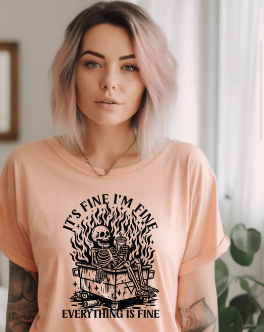 IT'S FINE I'M FINE EVERYTHING IS FINE (dumpster fire): Unisex T-shirt offered in PEACH