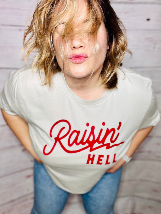 RAISIN' HELL *RED INK* Unisex T-shirt in HEATHER DUST